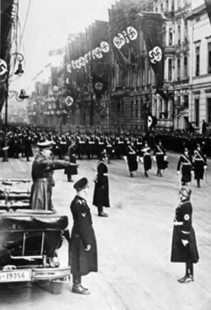 Adolf Hitler salutes a parade of his personal bodyguard regiment, the 1st SS Division Leibstandarte SS Adolf Hitler